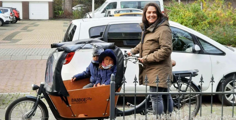 Angel Adina with the babysitters on the cargo bike