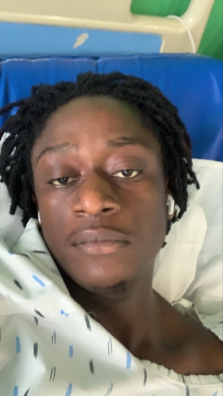 group of women in red and white dress standing on brown wooden bar during daytime