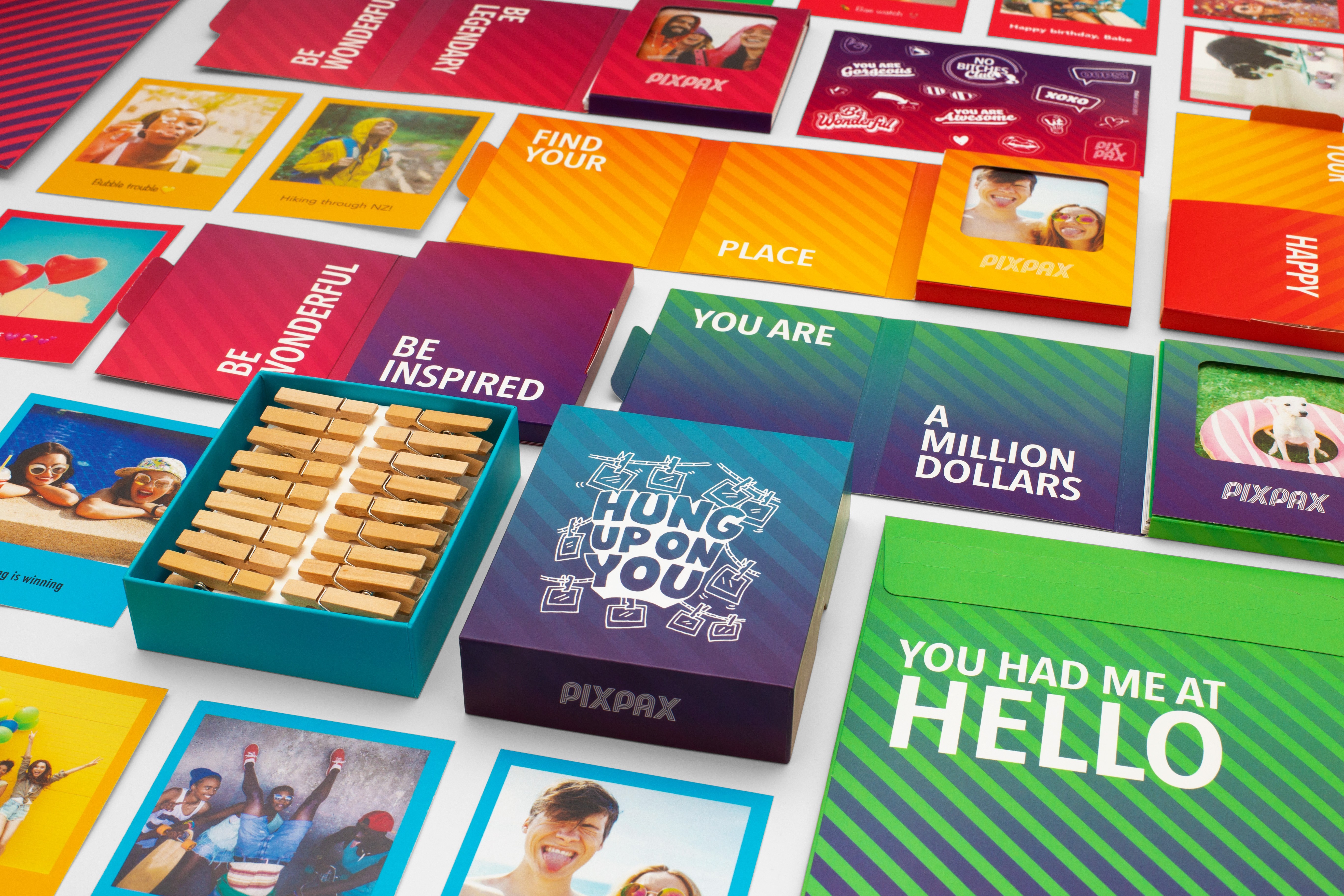A close-up of a hand wearing multiple decorative rings against a blue background.