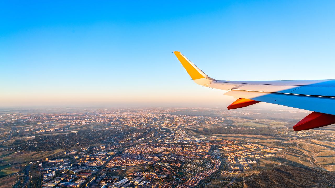 An image of a boat floating with the caption "FLOATING CITIES" above Mike Putman and James Ferrara, the No Tourists Allowed Podcast Hosts