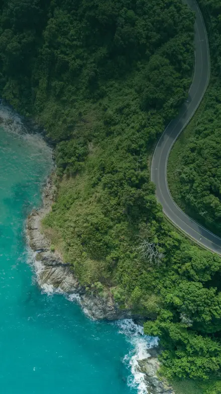 bird's eye photography of road near near body of water