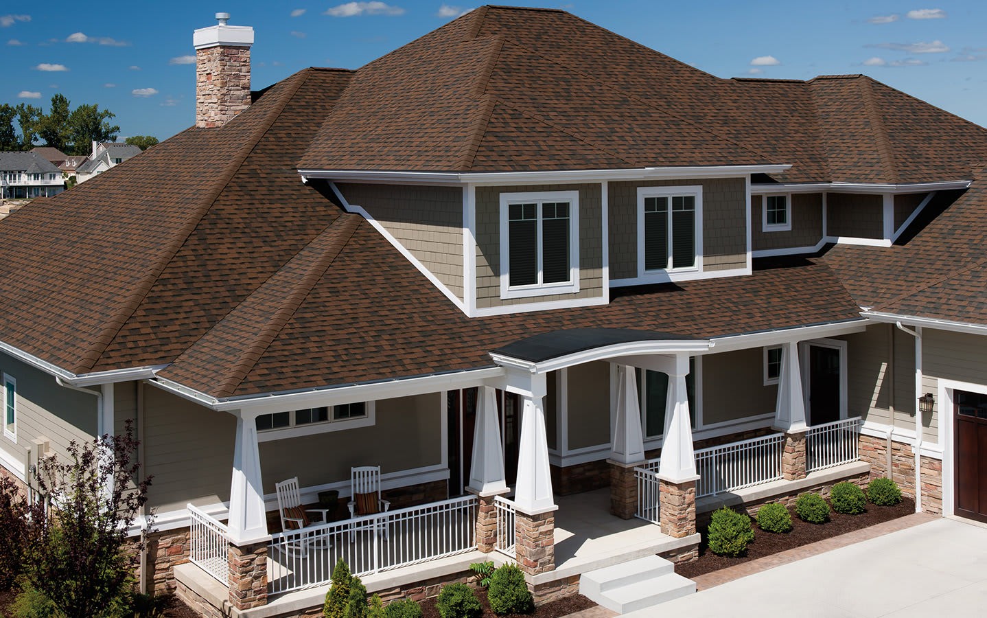 Beauty shot of a beautiful home with Owens Corning TruDefinition Duration shingles in Brownwood color.
