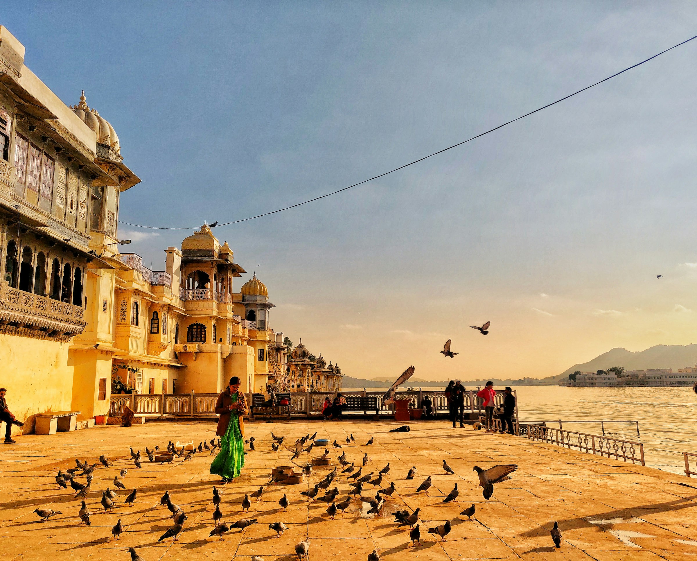 Udaipur City Palace on the lake at golden hour