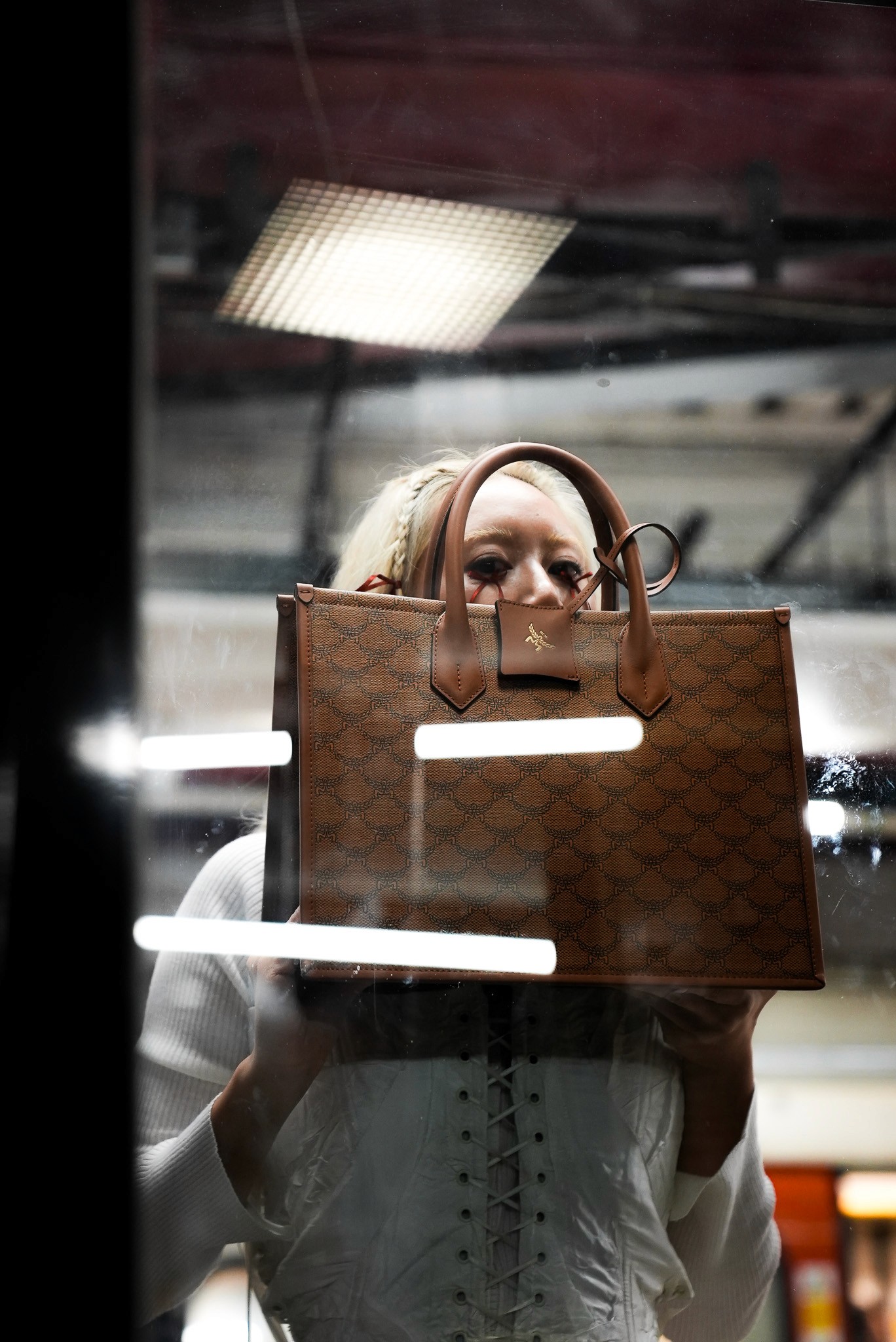Shiba Inu dog jumping to catch falling autumn leaves