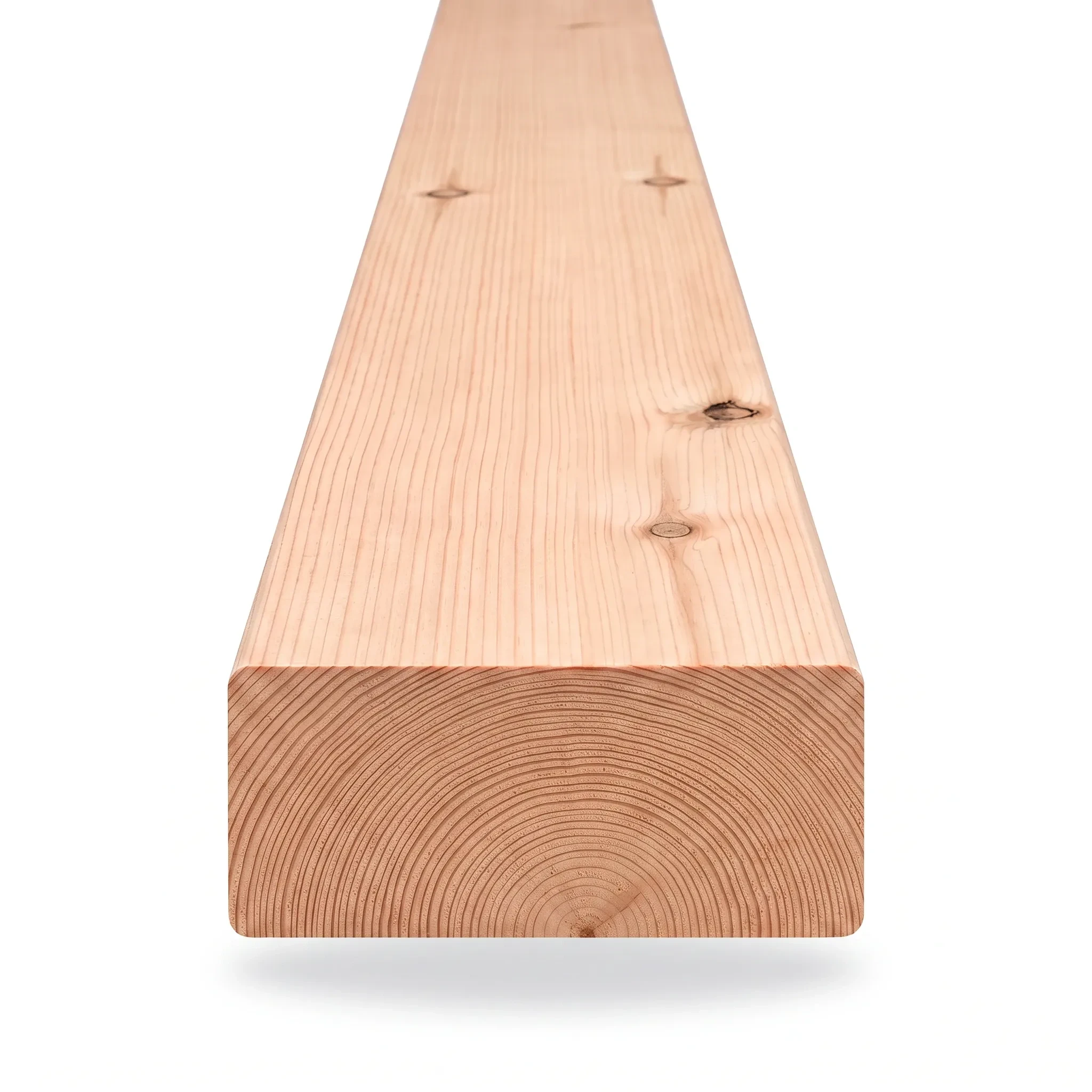 Dimensional lumber in pine, cedar, redwood, and Douglas fir arranged in a studio material display