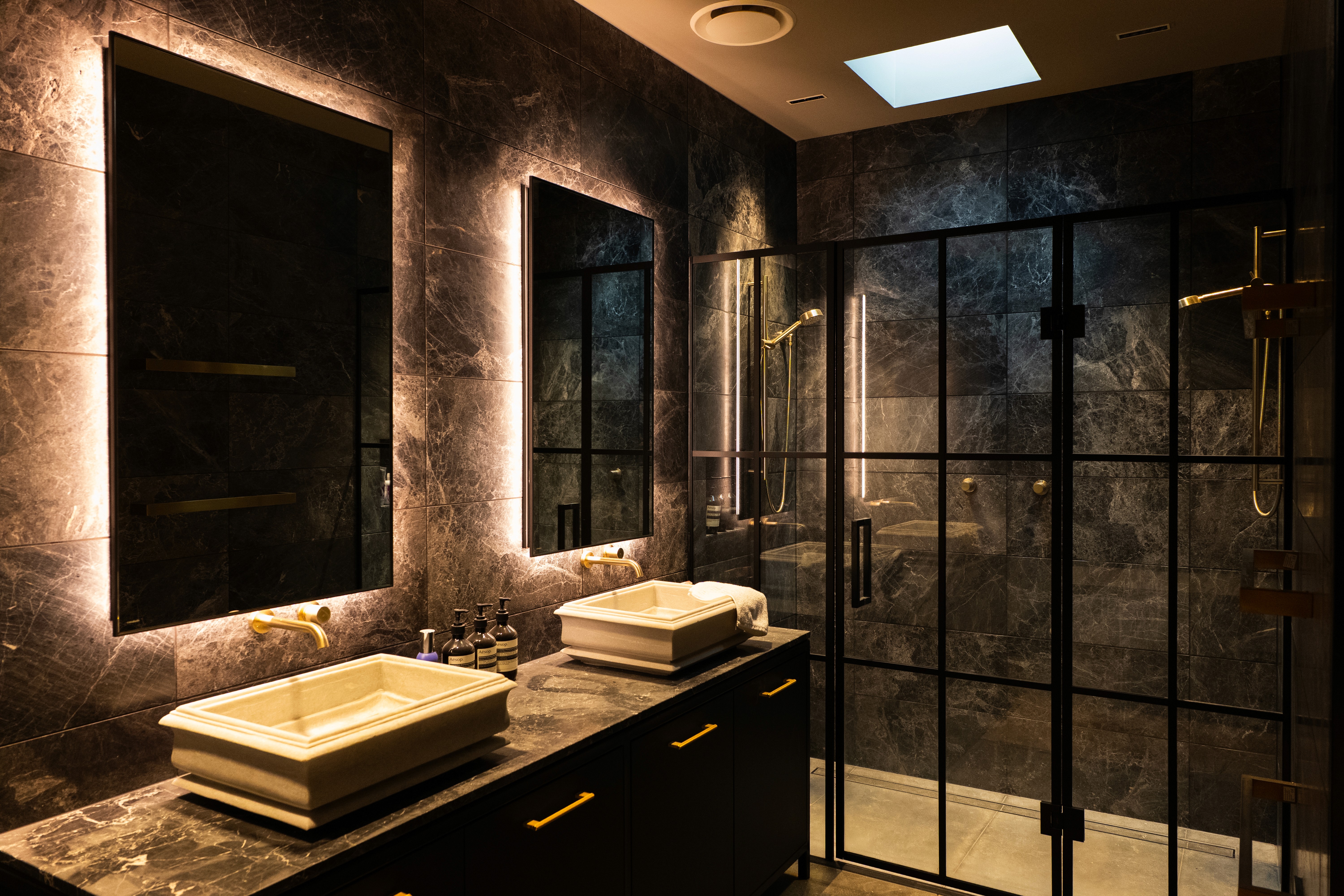 black and brown leather padded tub sofa