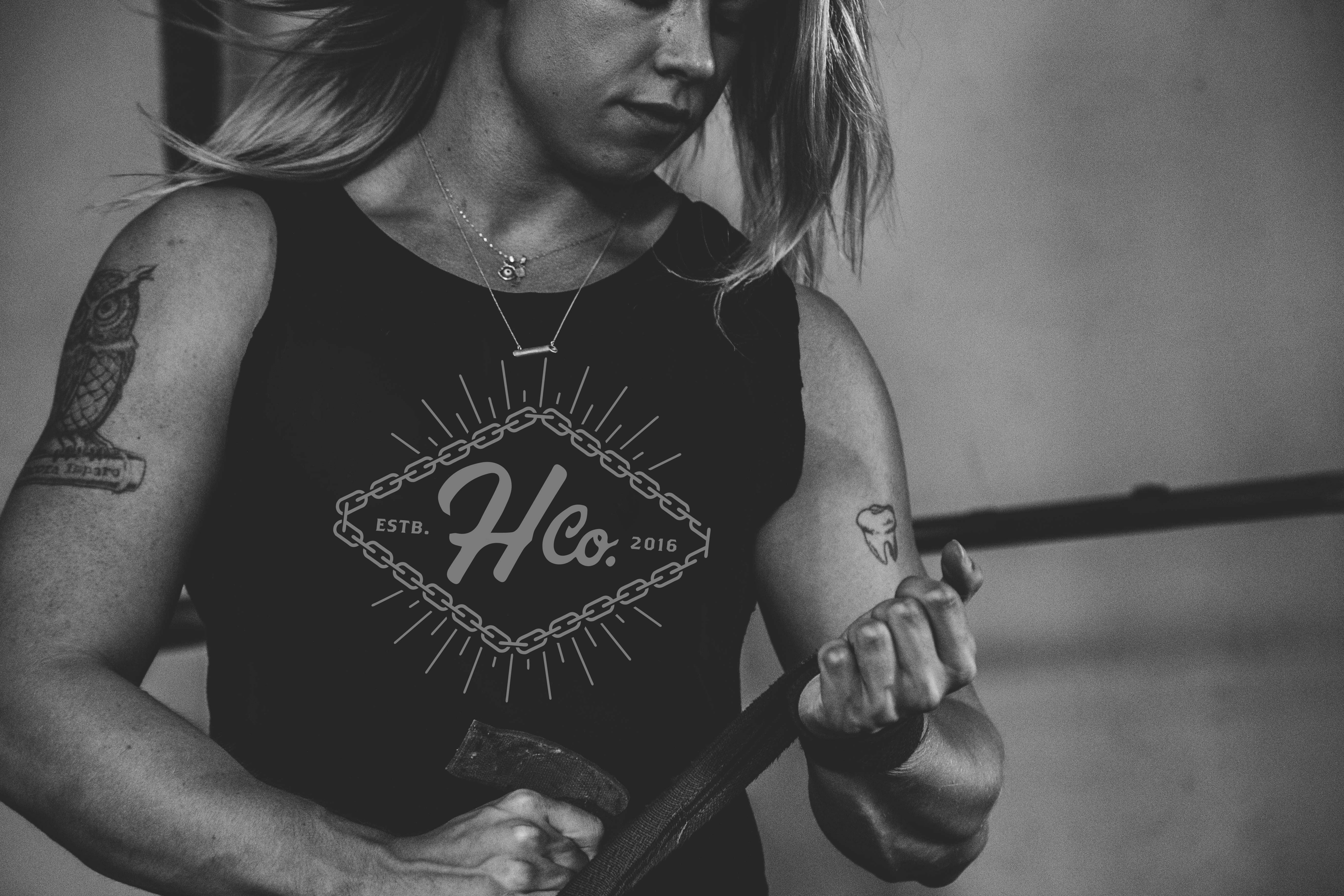 Athlete lifting weights wearing Handled Company tank top