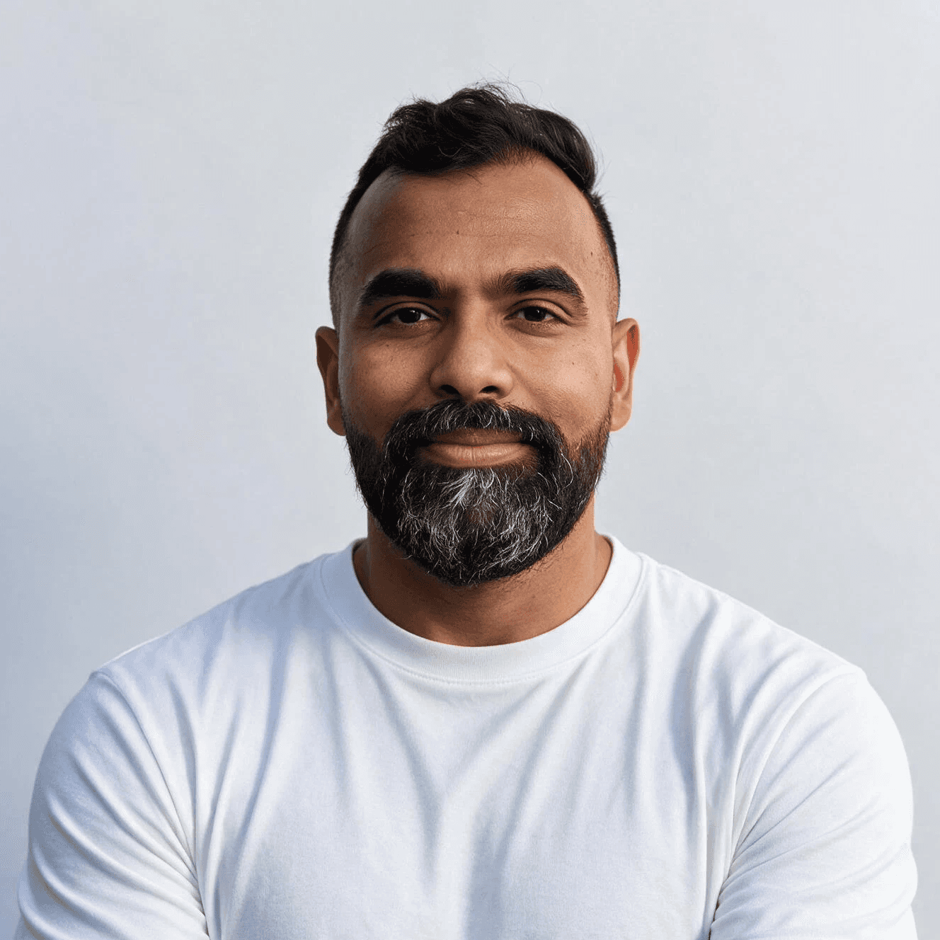 Man with beard and glasses wearing a black shirt
