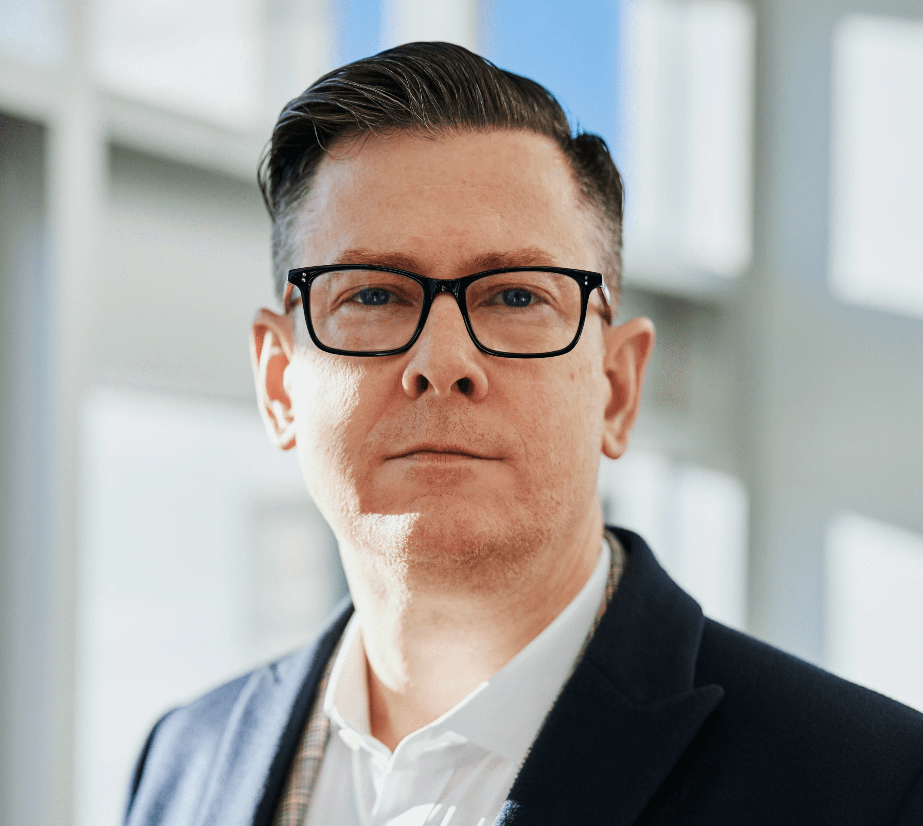 man standing beside wall