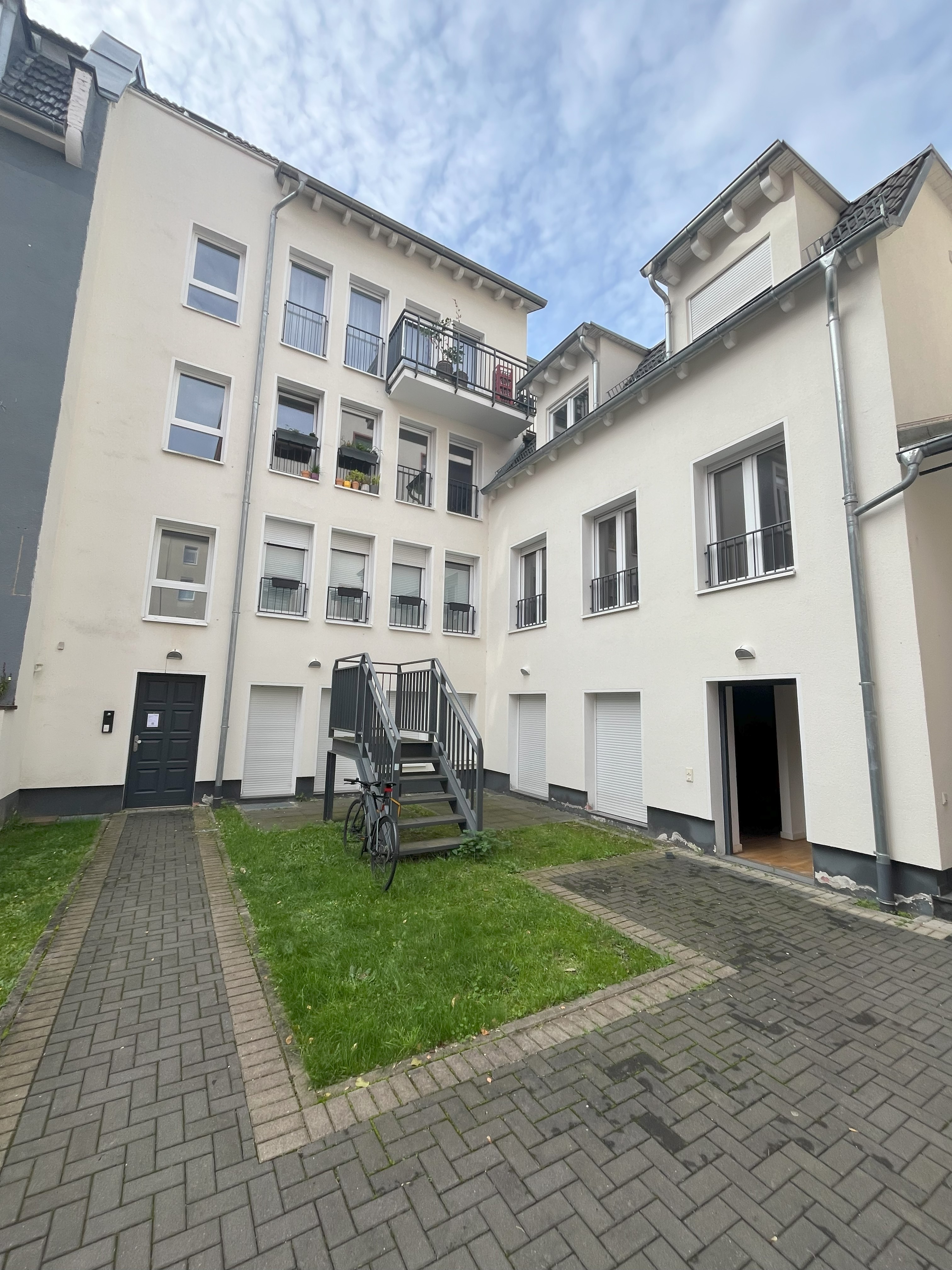 white and blue glass walled high rise building