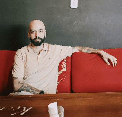 woman in black long sleeve shirt sitting on white couch