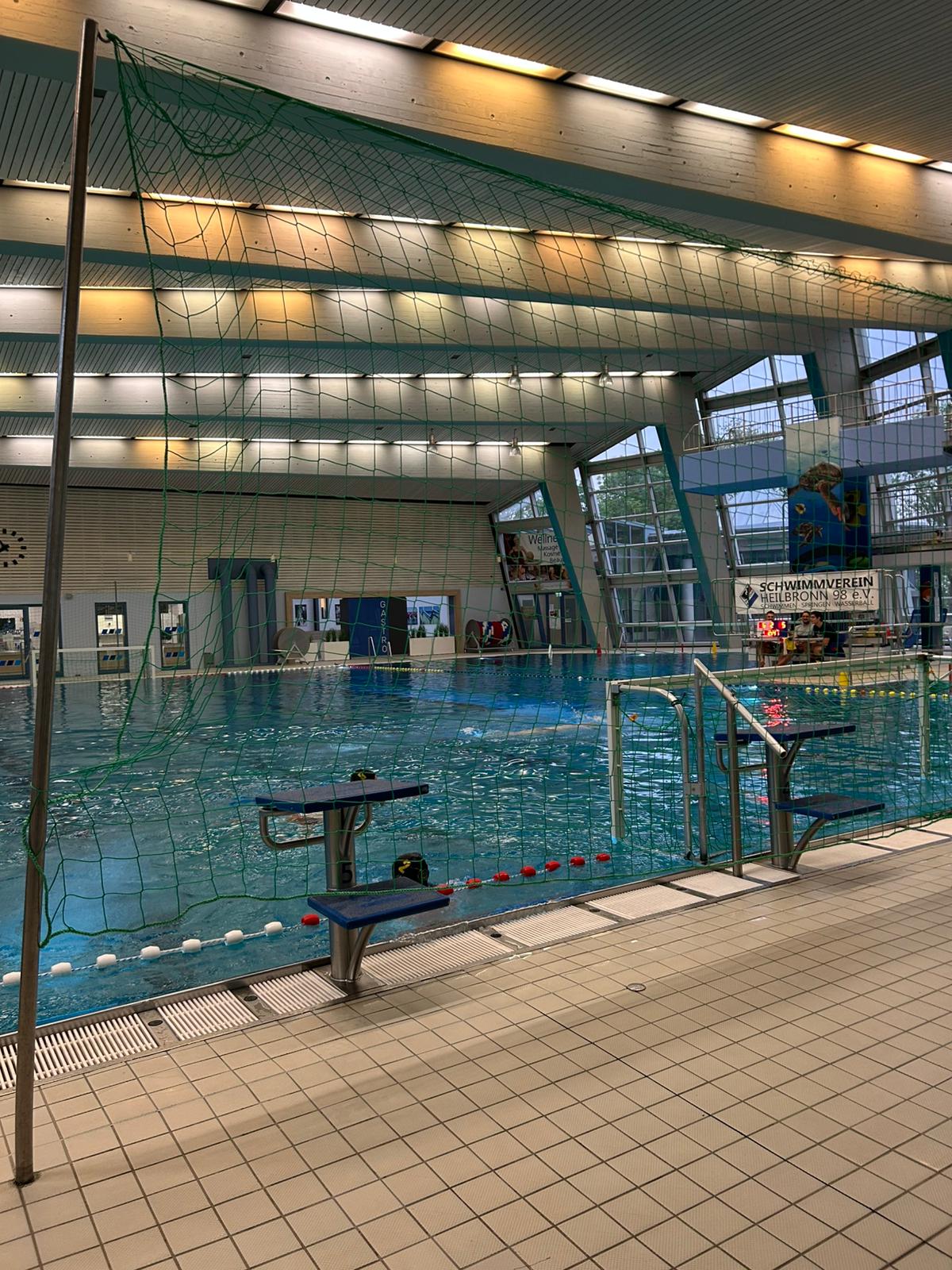 five people swimming on pool