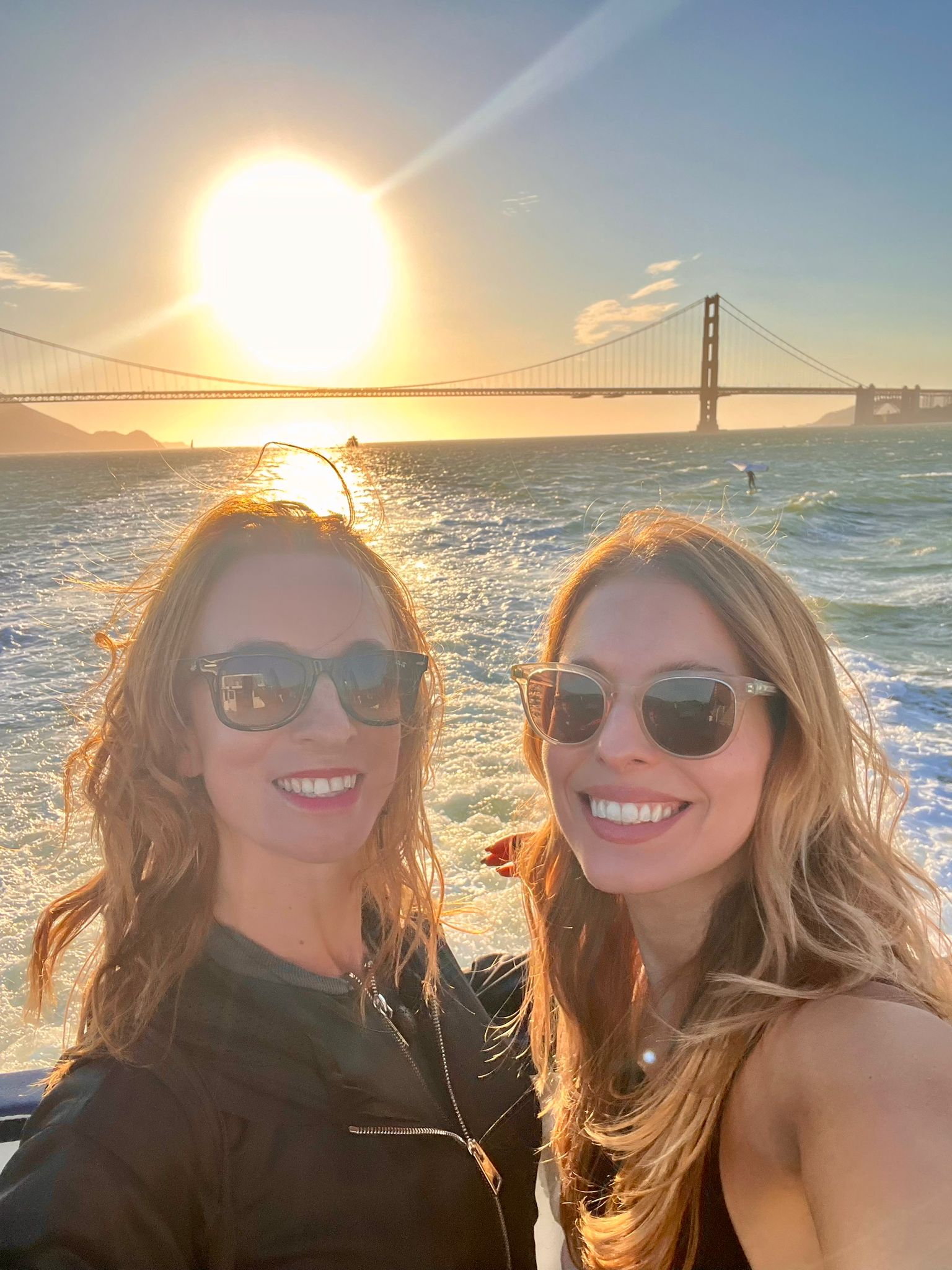Two women in front of Golden Gate bridge
