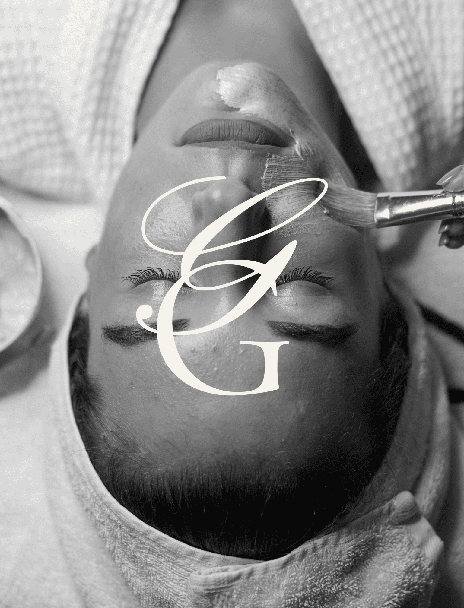 A woman getting a facial at a spa with the Glow Garden Studio submark overlayed