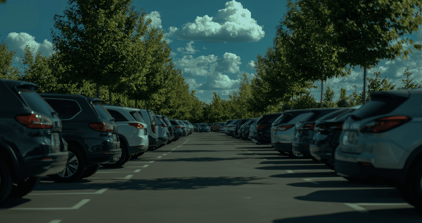 Person relaxing in their car with their feet resting out of the window, renewing their vehicle licence on their phone.