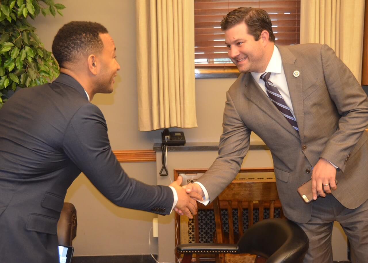 Rick ward shaking hands with a man