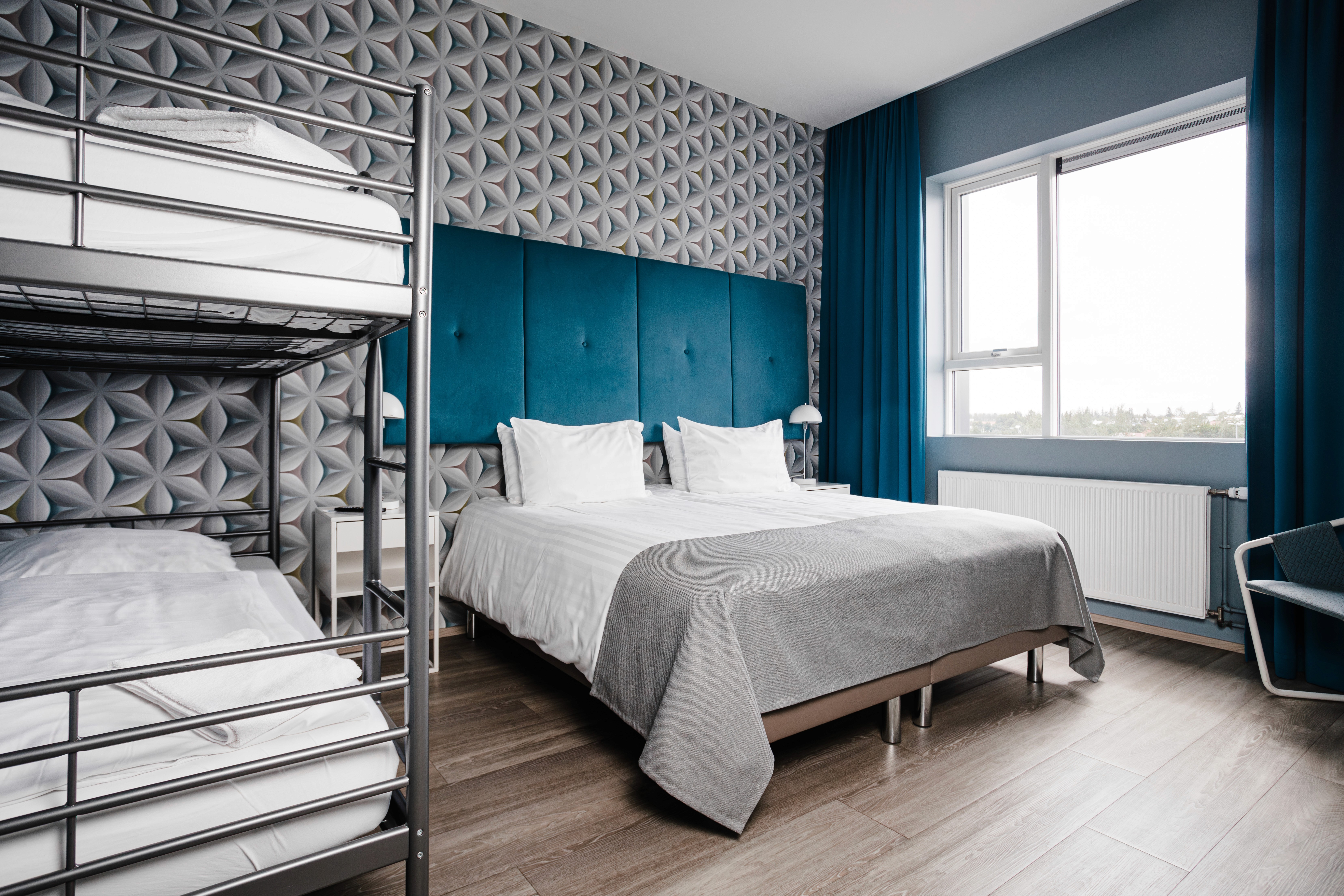 Family room with bunk beds at ODDSSON Midtown Hotel in Reykjavík.