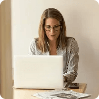 Woman working at a desk on laptop