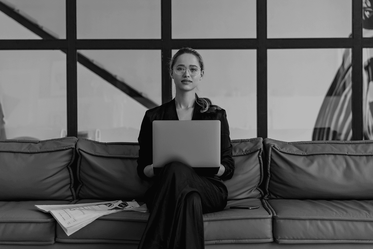 Black and white image of a woman looking towards the left side