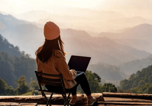 <img src="your-image.jpg" alt="A girl sitting on a chair in the mountains, enjoying the scenic view." />

