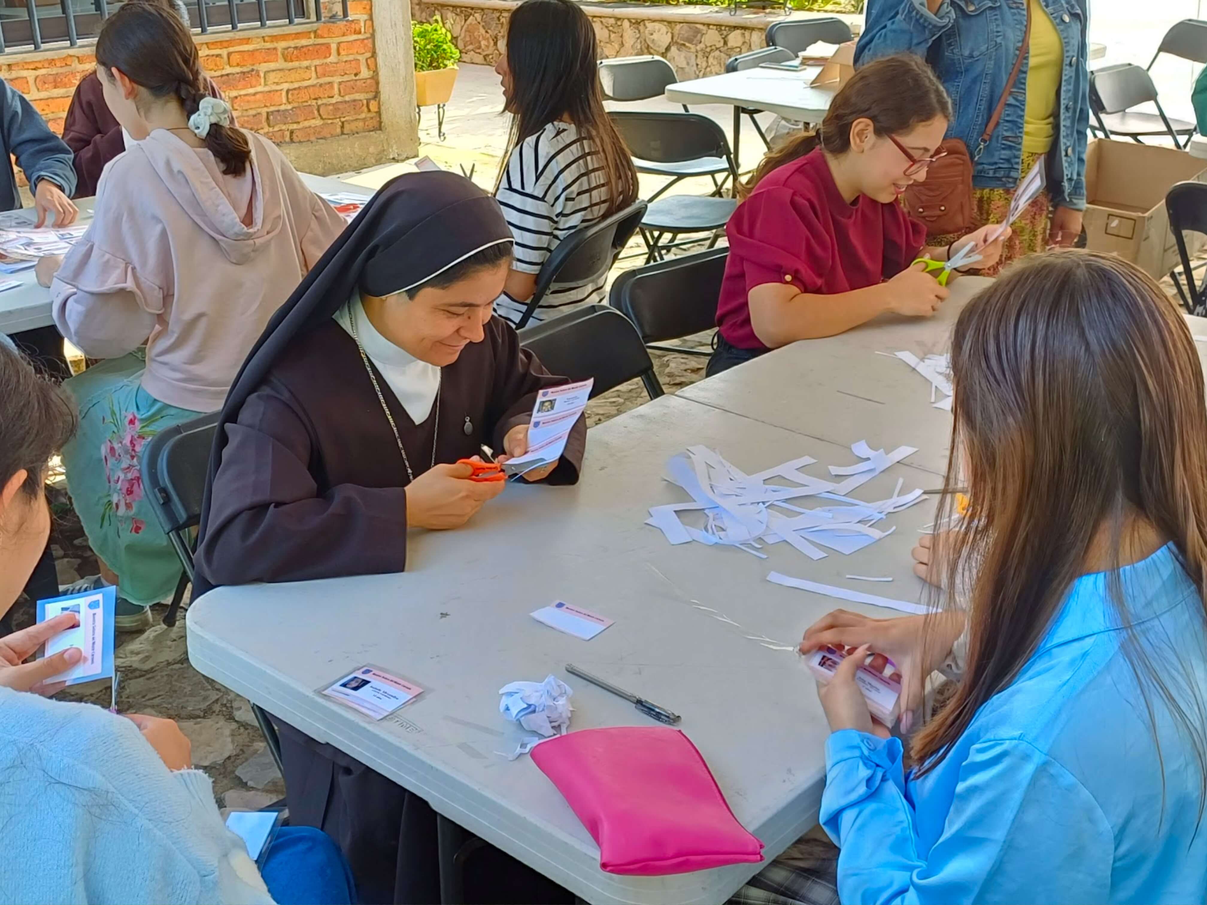 a group of children sitting on steps in front of a building