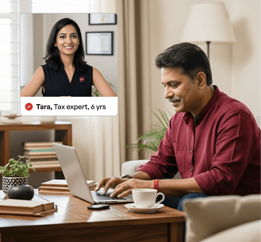 Man working on a laptop at home with a video call window showing a smiling female tax expert. There is a verified tag with the text "Tara, Tax expert, 6 years"