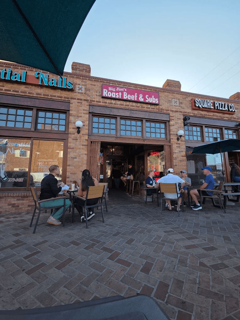 A bunch of locals eating outside of Big Jim's Roast Beef during lunch time located in Pacific Beach, San Diego