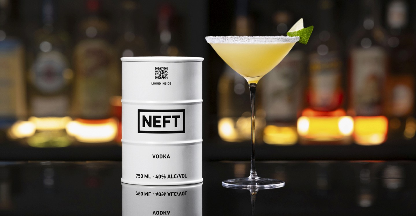 A NEFT Barrel and a glass of Marilyn Martini on a bar counter.