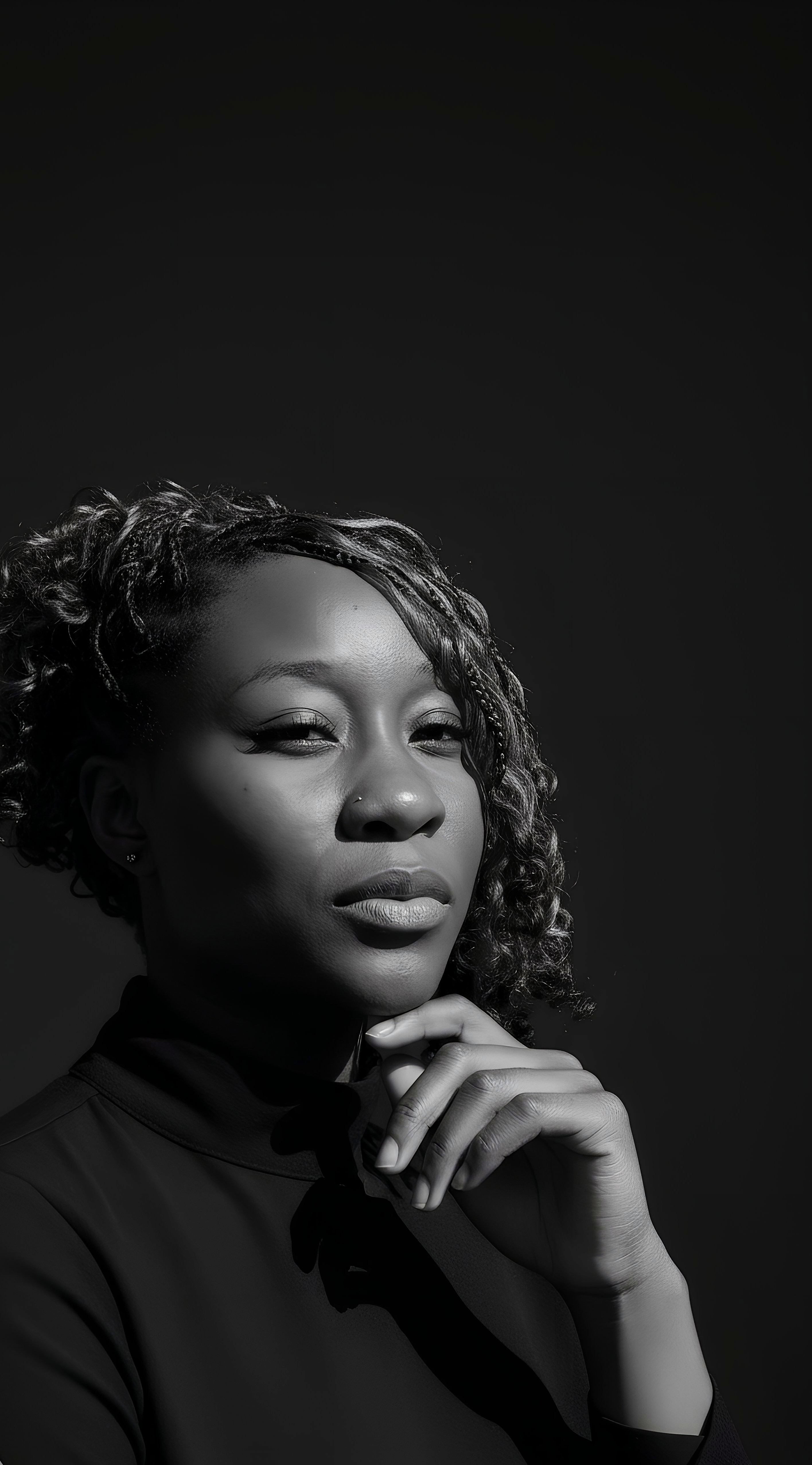 Confident woman in black-and-white portrait representing authenticity, strength, and verified digital identity with Profiled Nigeria.