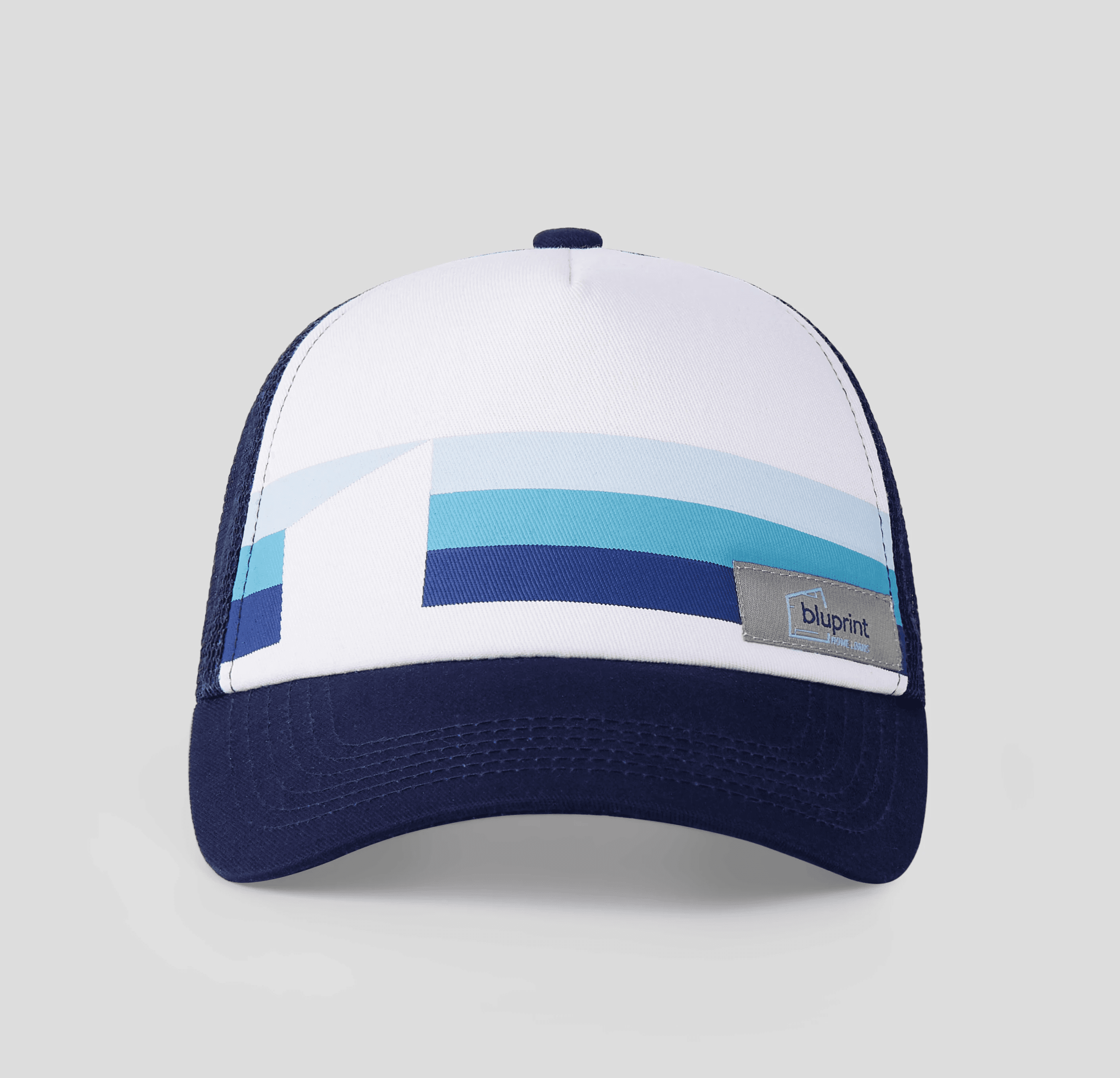 A colorful five-panel cap with "Austin, Texas Sung Productions" embroidered on the front, featuring red, yellow, and pink segments on a light gray background.