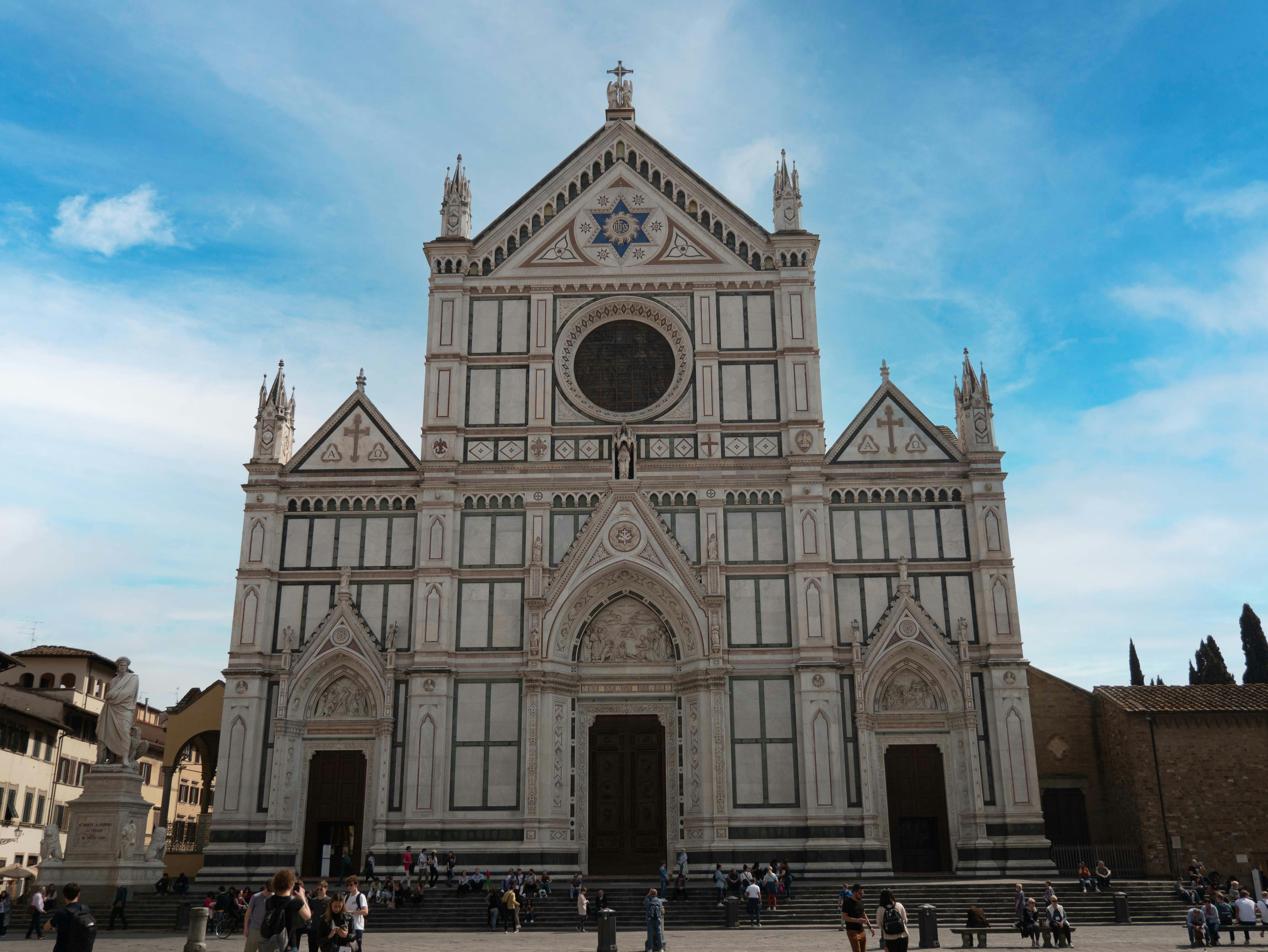 a large cathedral with a clock on the front of it