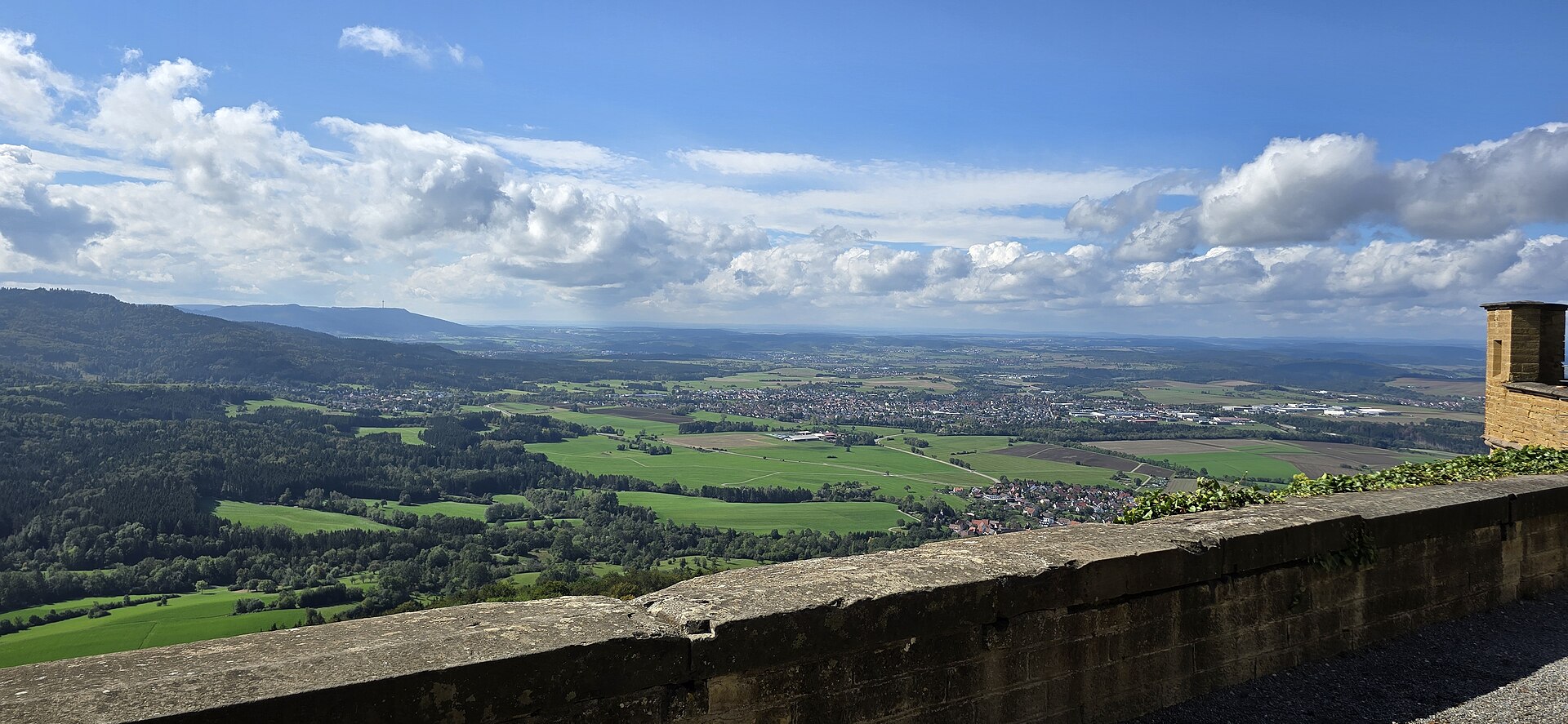 aerial view of village on mountain cliff during orange sunset