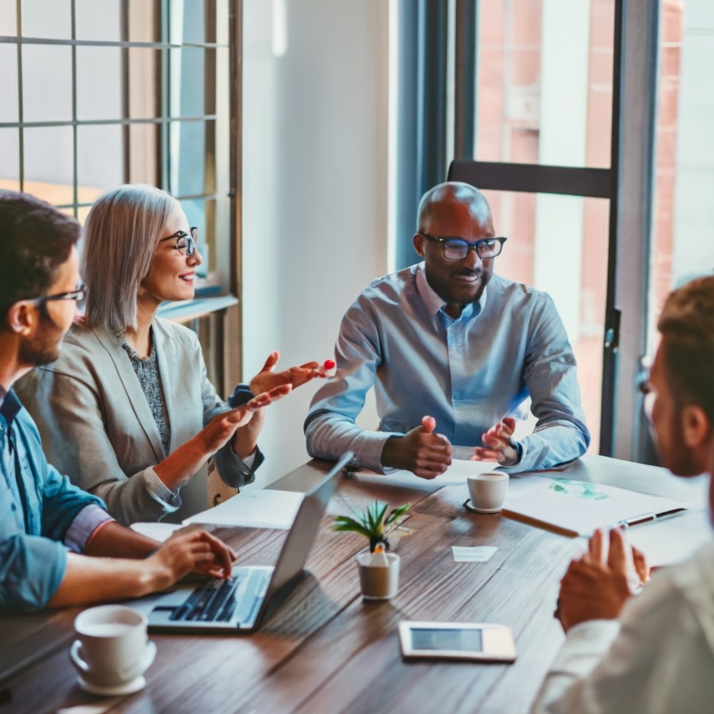 Diverse group of professionals discussing EB5 Visa investment opportunities