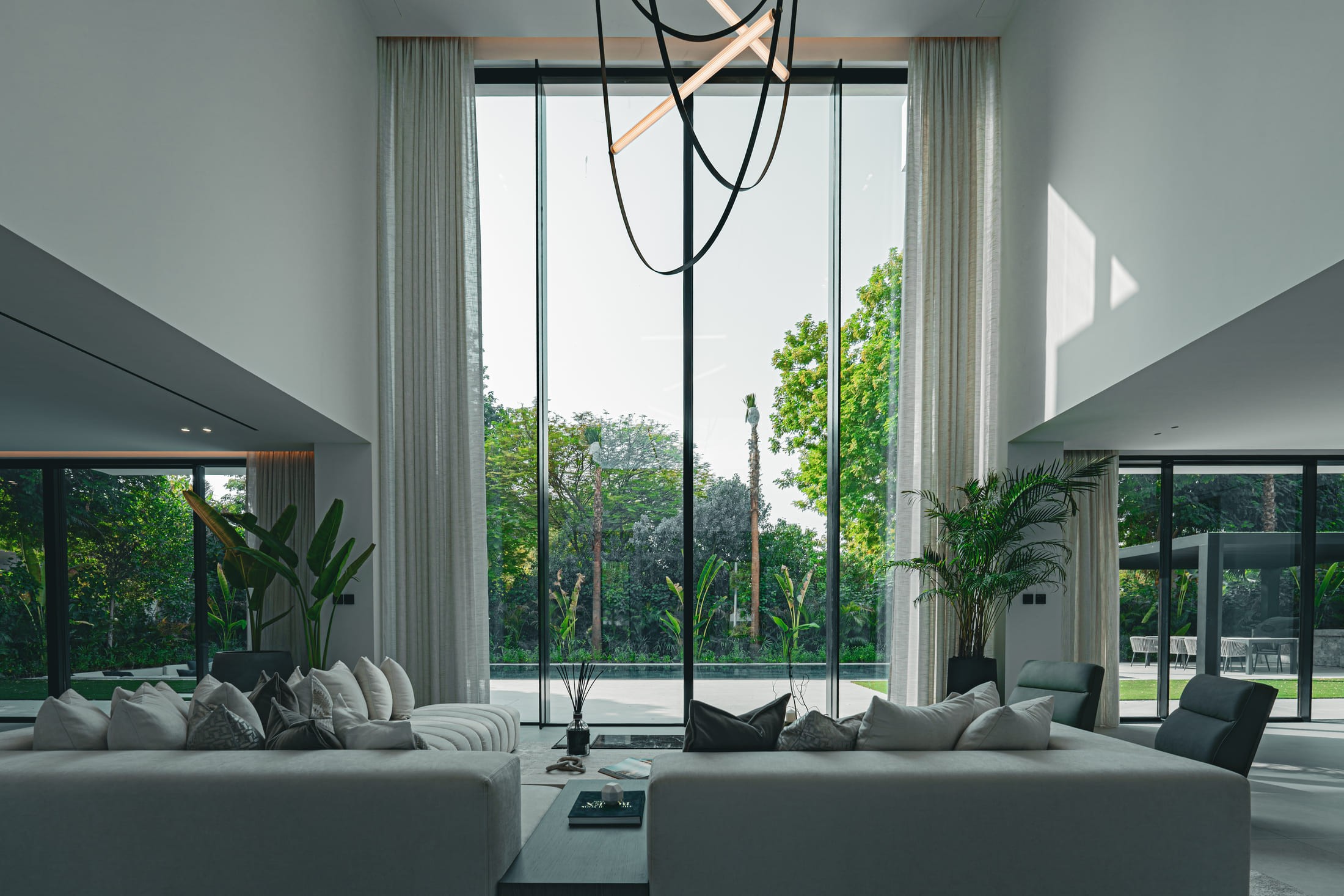 Image of a large villa with big glass windows 