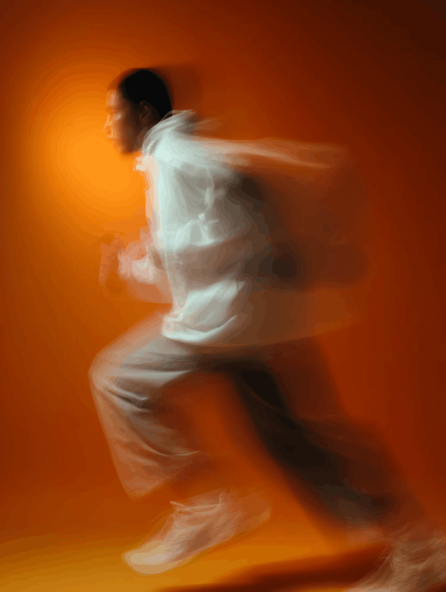 Runner in motion captured with dynamic blur on warm background.