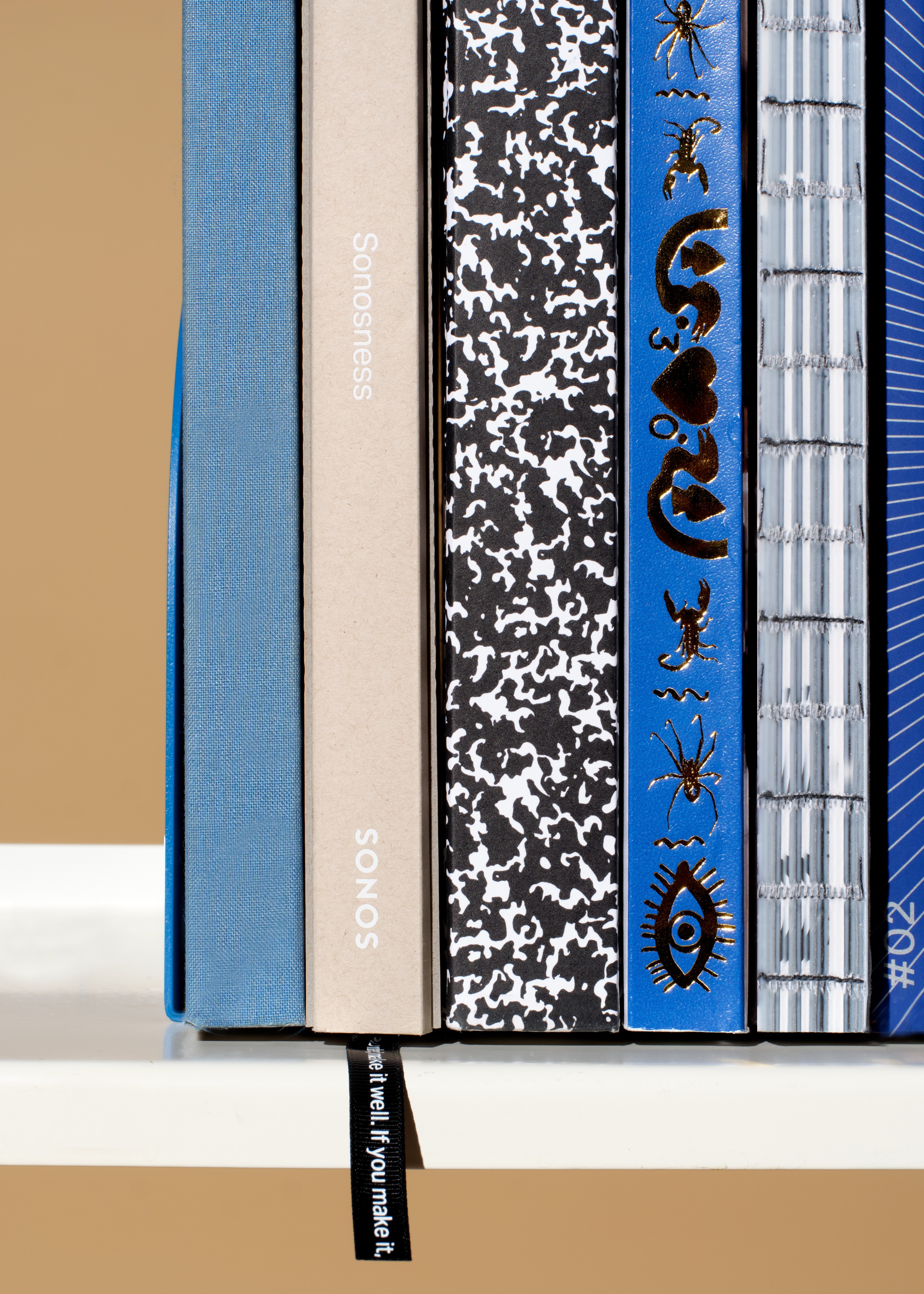 Streetside billboard with flyposters of the Batch.Works brand and illustrations