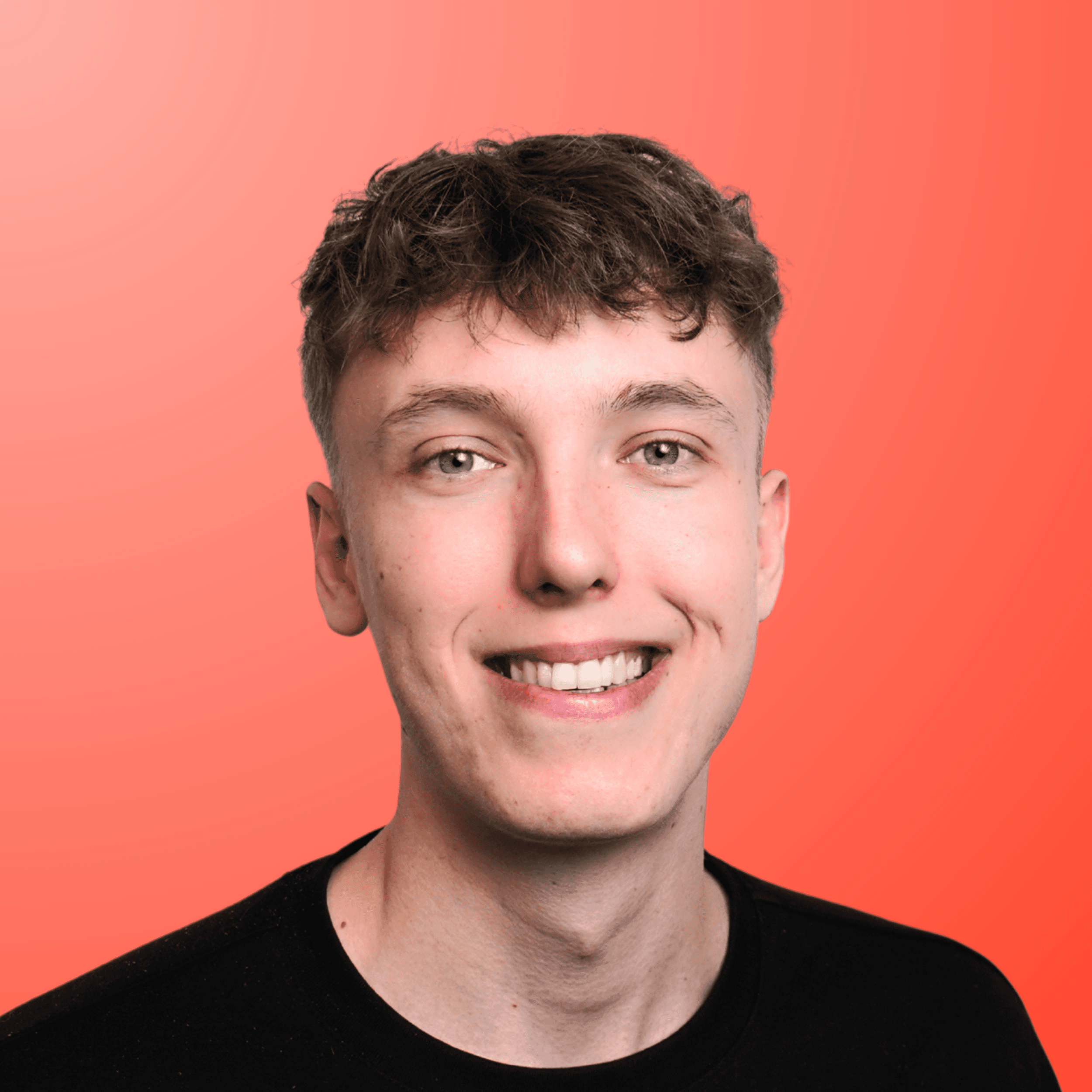 a man in a suit and tie sitting in a chair