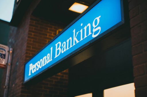Personal banking sign on a bank branch facade