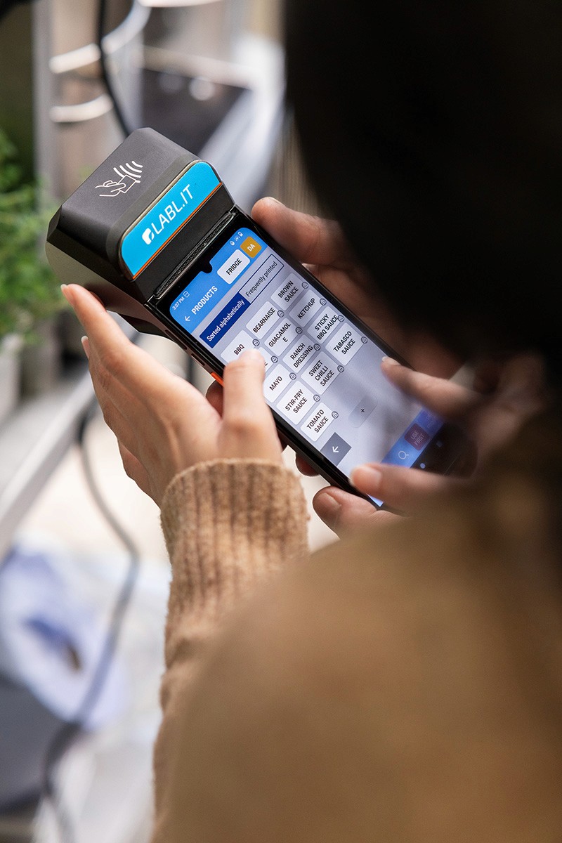 Two people using a Labl.it device.