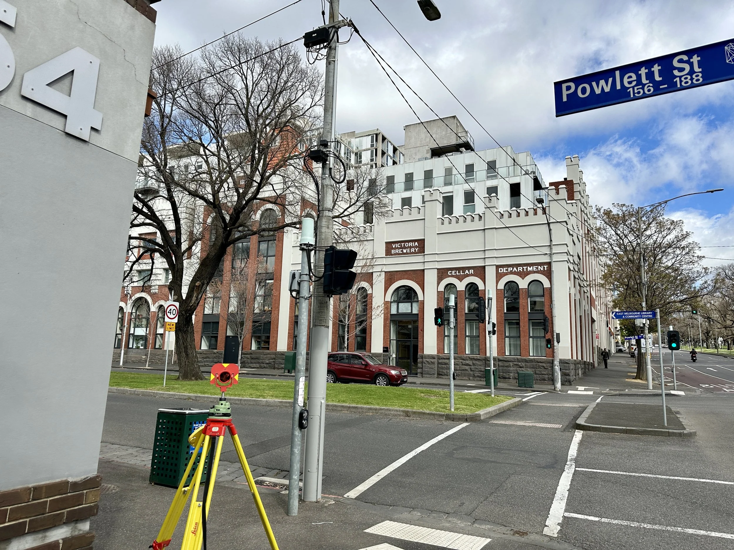 Professional Land Surveying equipment set up on a Melbourne City street