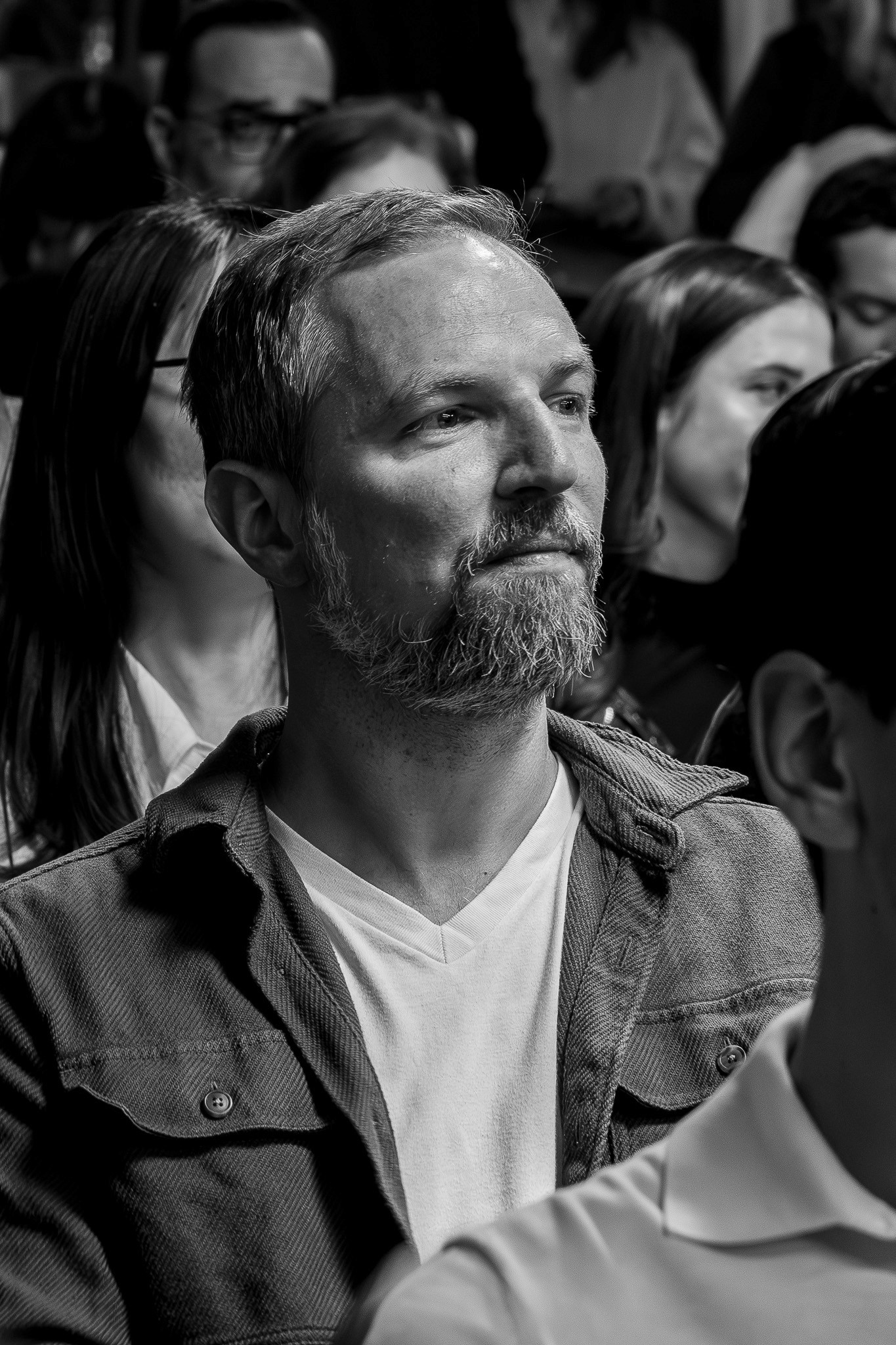 Attendee listening during a blockchain conference presentation at CV Summit.