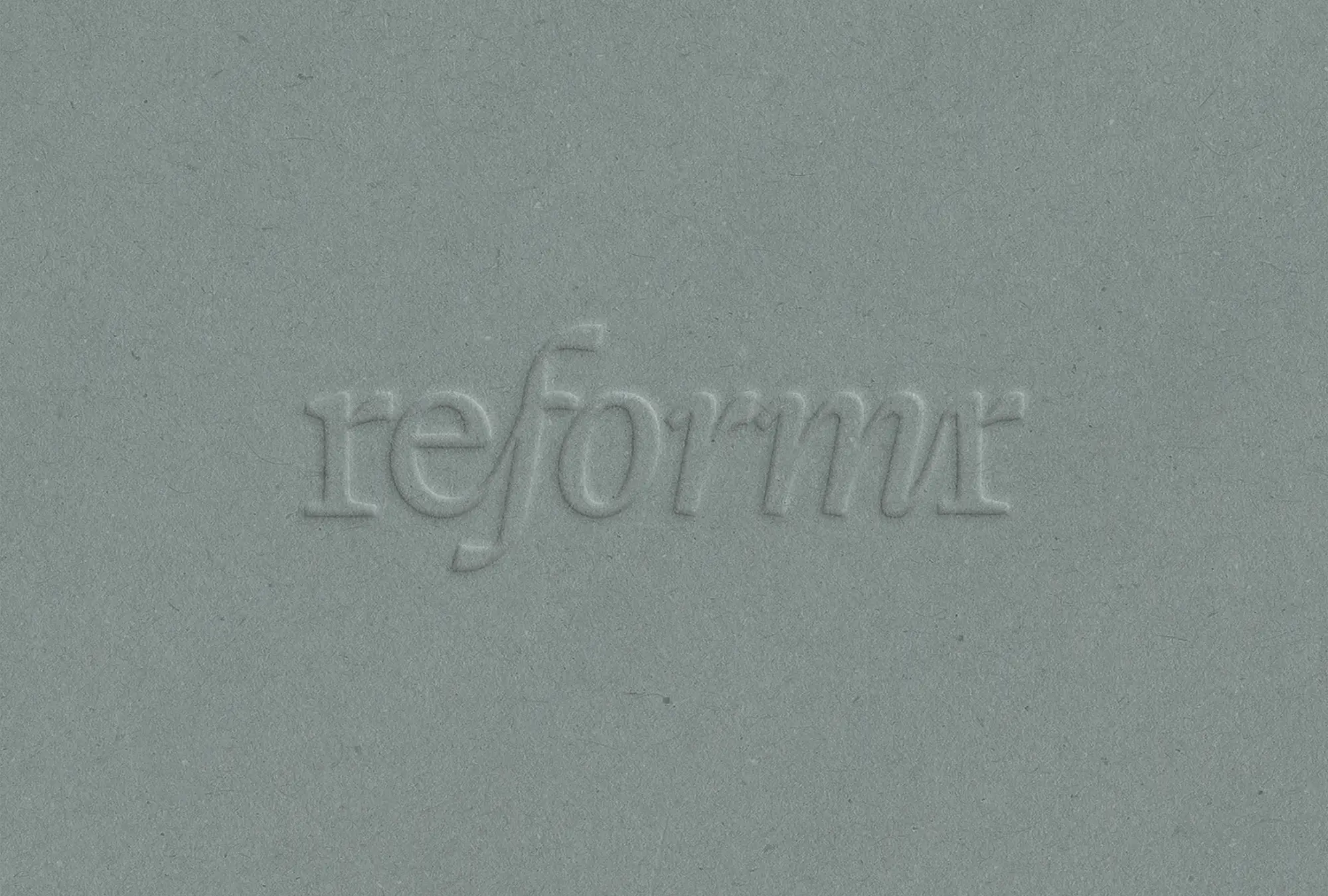 Reformr wordmark logo embossed on textured paper