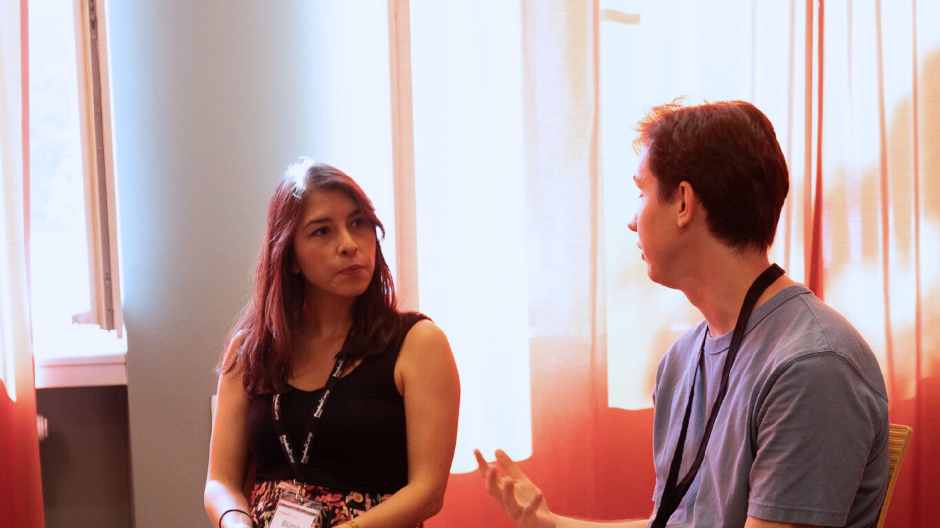 person sitting on grass and using phone