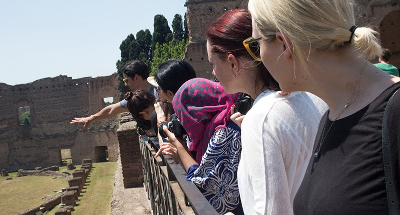 group of students listening to the guide