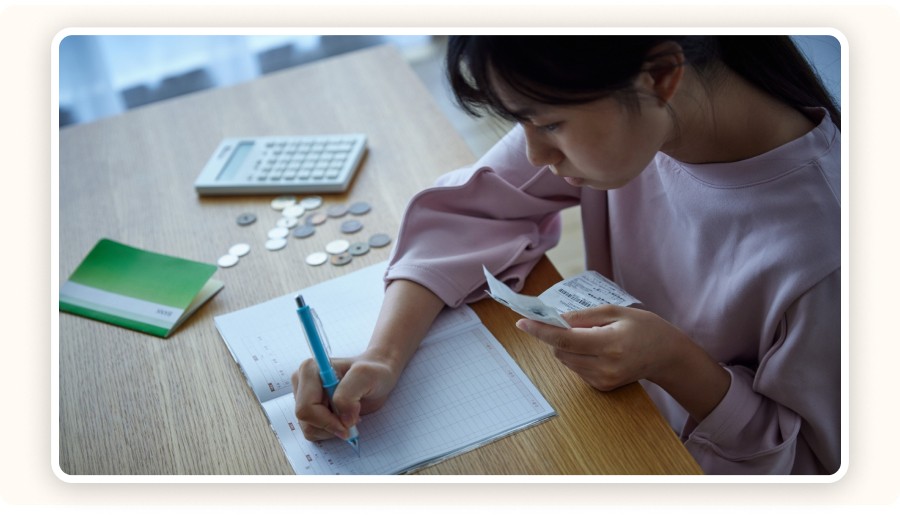 Woman writing on agenda