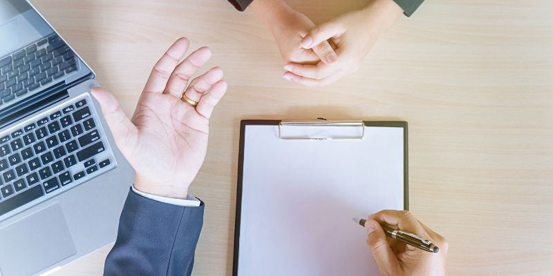 A person interviewing a potential F&B employee