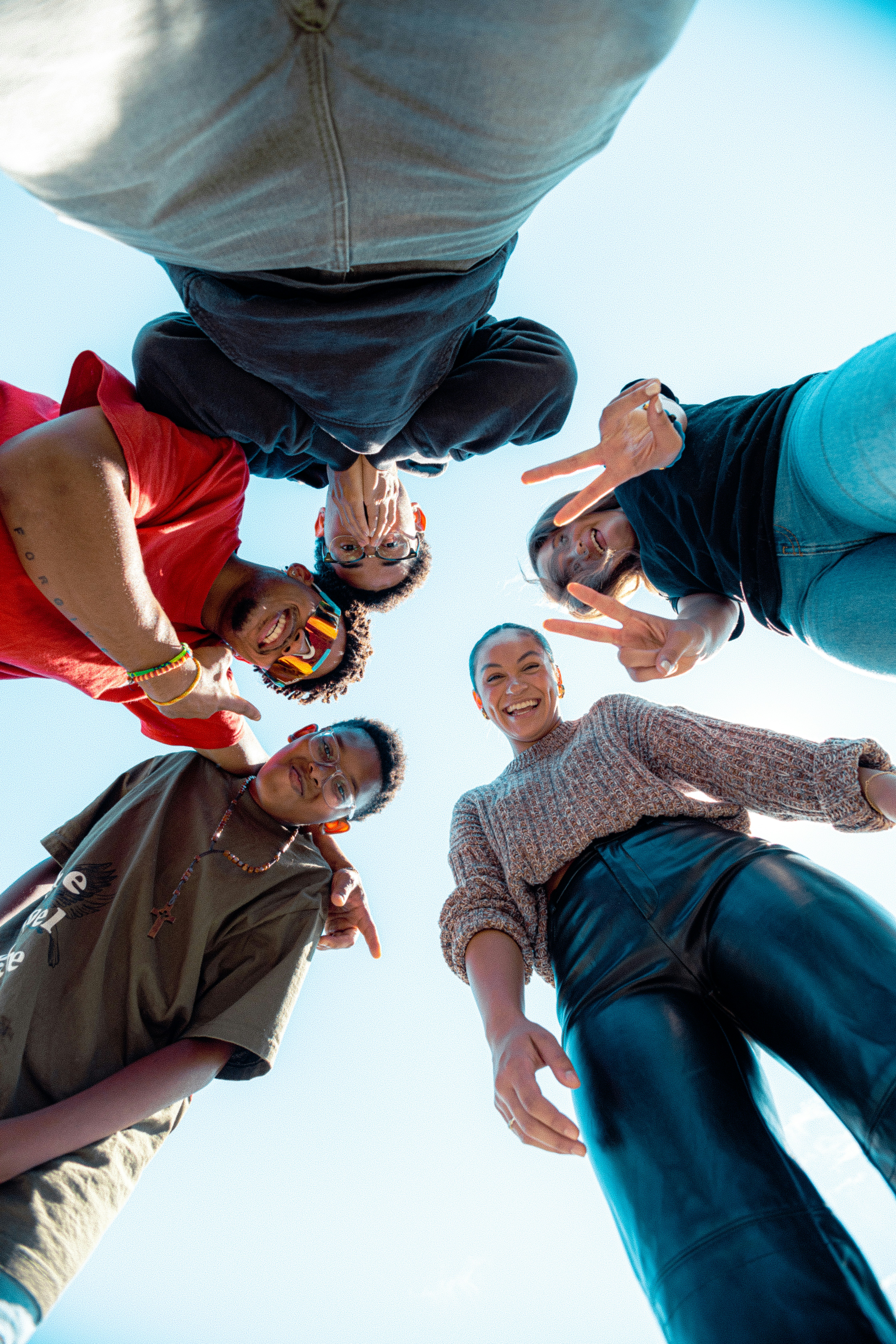 A low-angle shot of a diverse group of friends, symbolizing the importance of understanding a specific **target audience**.