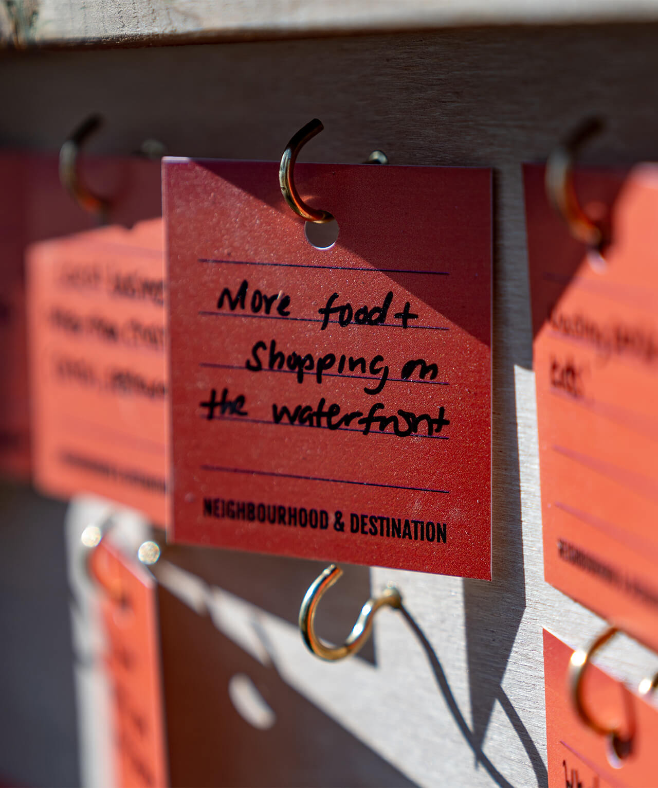 Closeup of an audience-written response that reads "More food and shopping on the waterfront."