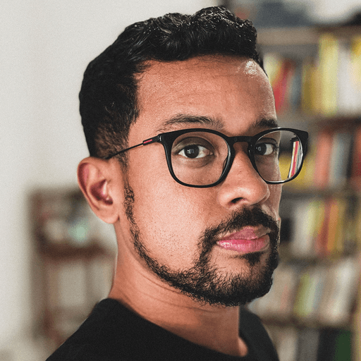 man in white crew neck shirt wearing black sunglasses
