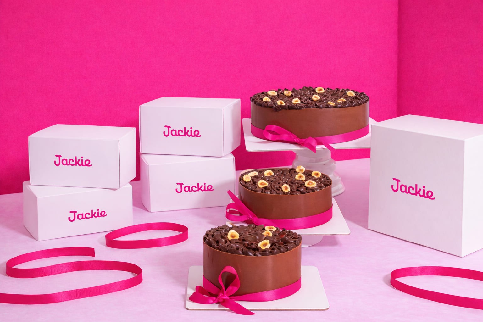 Interior view from living area toward the lake, large glass facade, minimal furniture.